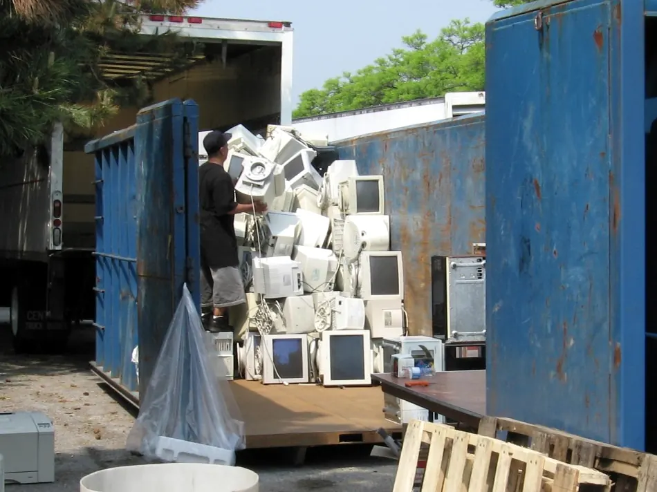 A pile of old CRT computer monitors collected for disposal